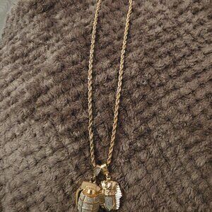 Gold necklace and charms